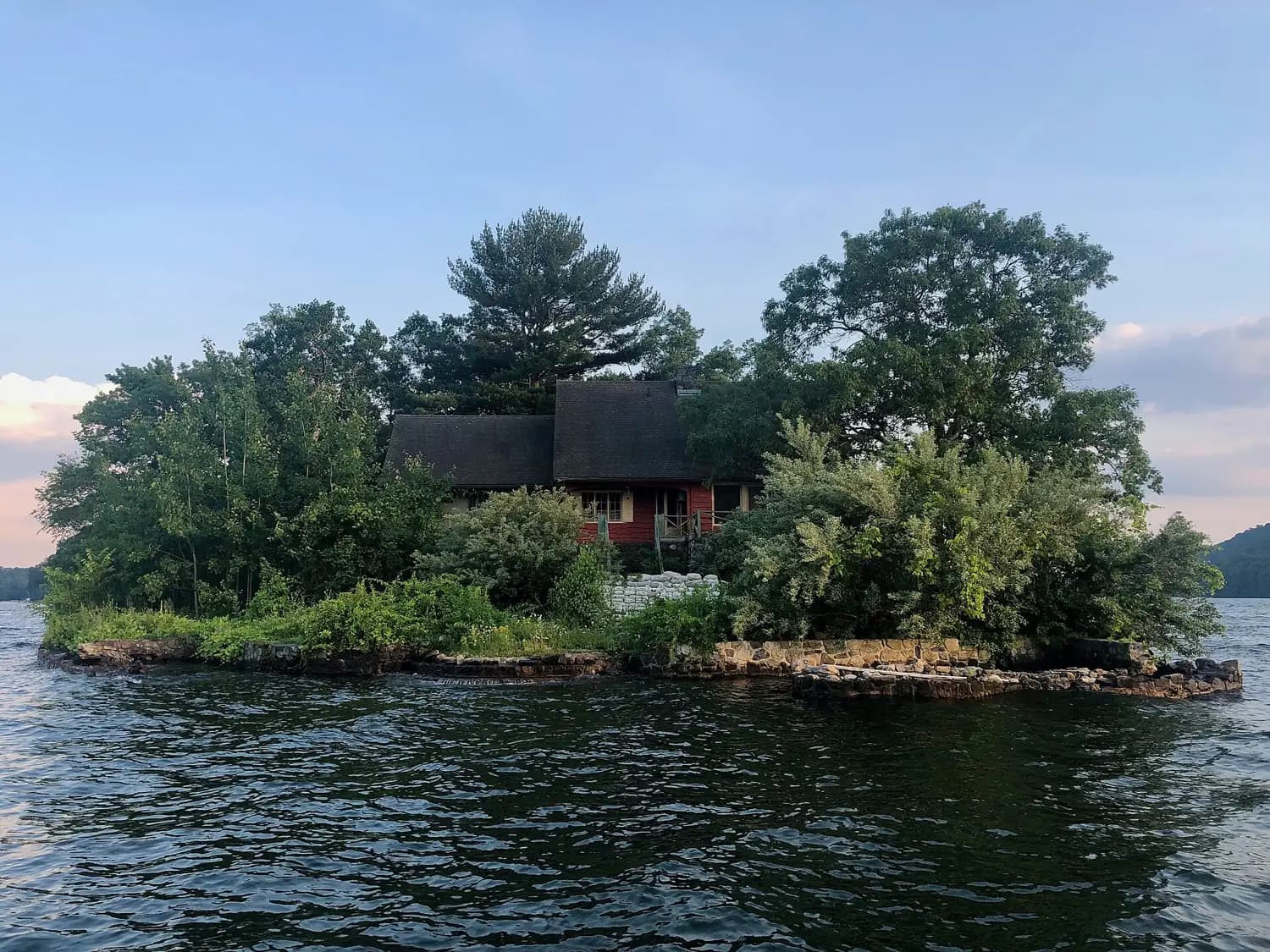 A small wooded island with a house on Candlewood Lake, Connecticut